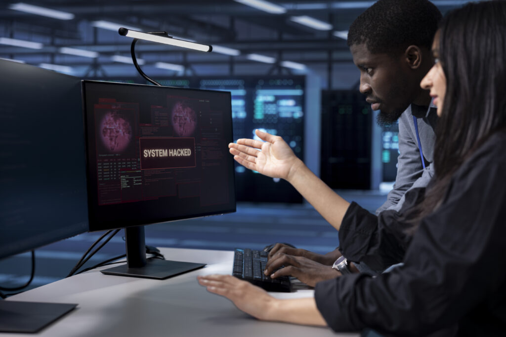 Programmers Doing Teamwork Server Hub Trying Protect Hardware From Hacker 1024x683